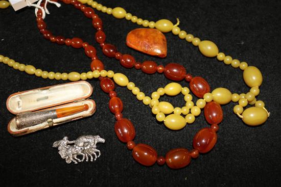 Amber brooch, cornelian beads, cigarette holder etc.